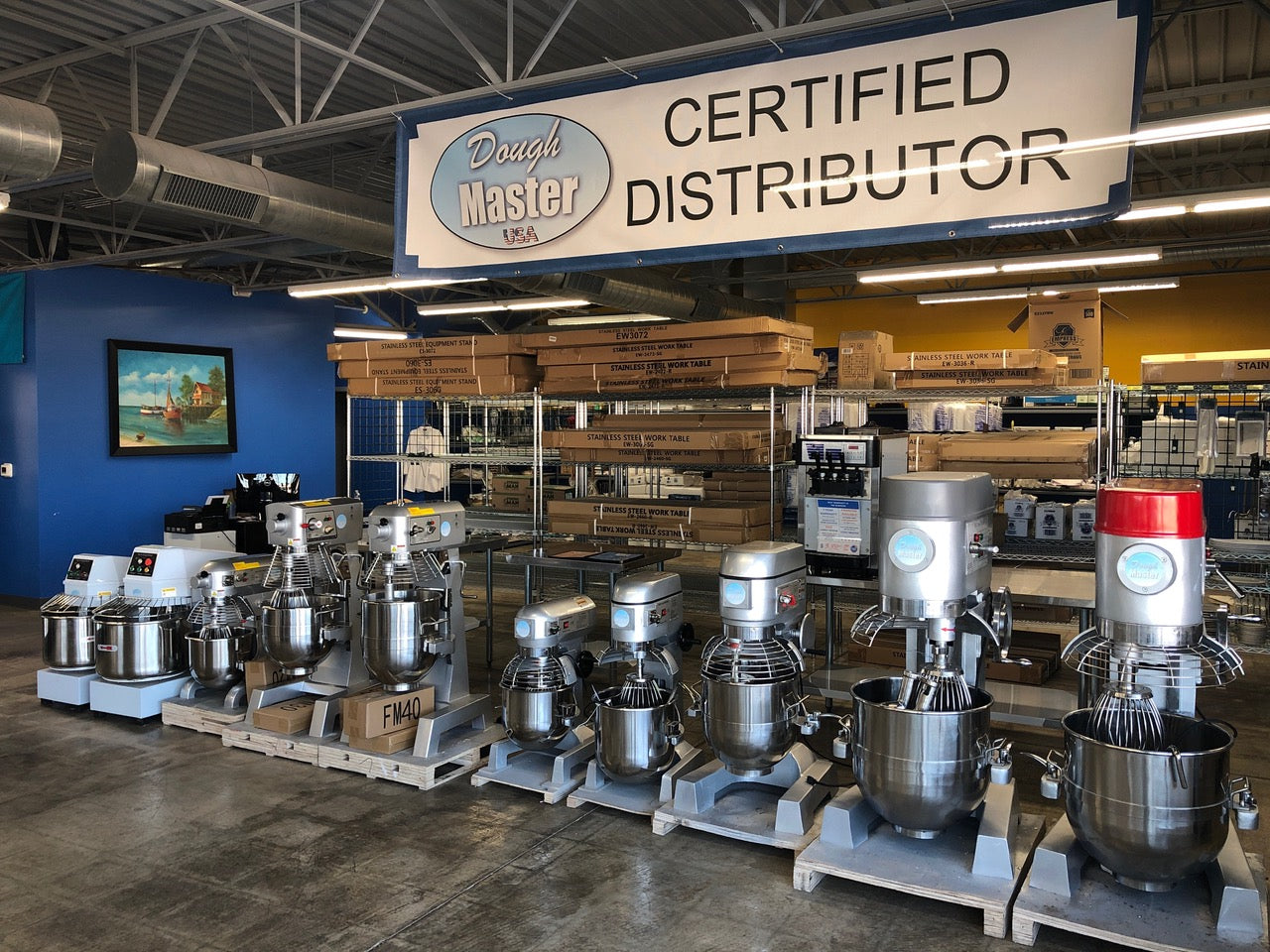 Planetary dough mixers lined up on a showroom floor